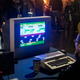 A guy playing Frogger on a very old computer